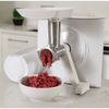 Modern food grinder attachment processing fresh ground meat into a white bowl on a kitchen countertop, ideal for Kitchen & Food, Kitchen Gadgets, Cooking and Baking Helpers, Butchering Supplies, and Best Sellers collections.