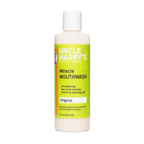 Plastic bottle of natural, alcohol-free mouthwash labeled as pH balancing with trace minerals and cleansing oils, crafted for strong teeth and gums, featured in Health & Wellness, Grooming and Personal Hygiene, USA Made, and Best Sellers collections.