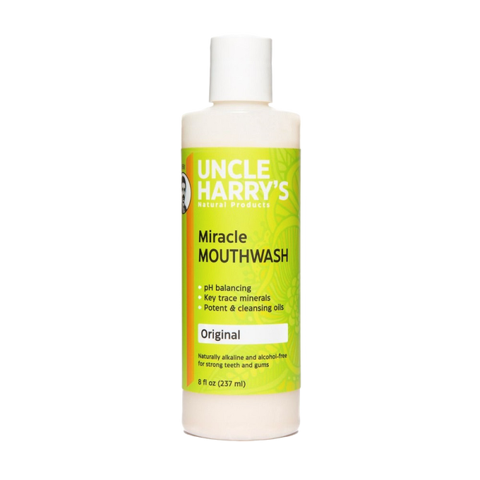 Plastic bottle of natural, alcohol-free mouthwash labeled as pH balancing with trace minerals and cleansing oils, crafted for strong teeth and gums, featured in Health & Wellness, Grooming and Personal Hygiene, USA Made, and Best Sellers collections.