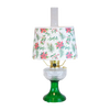 Handcrafted oil lamp with clear over emerald glass base and festive holly and pine patterned lampshade, featured in Lamps & Lighting, Oil Lamps, Table Lamps, and Best Sellers collections.