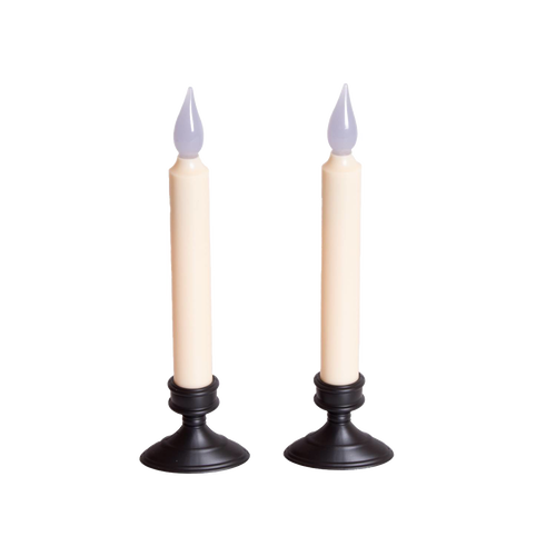 Pair of slender cordless LED taper candles with black bases and amber flickering flames, designed for safe window display and holiday decor in lamps and lighting collections.