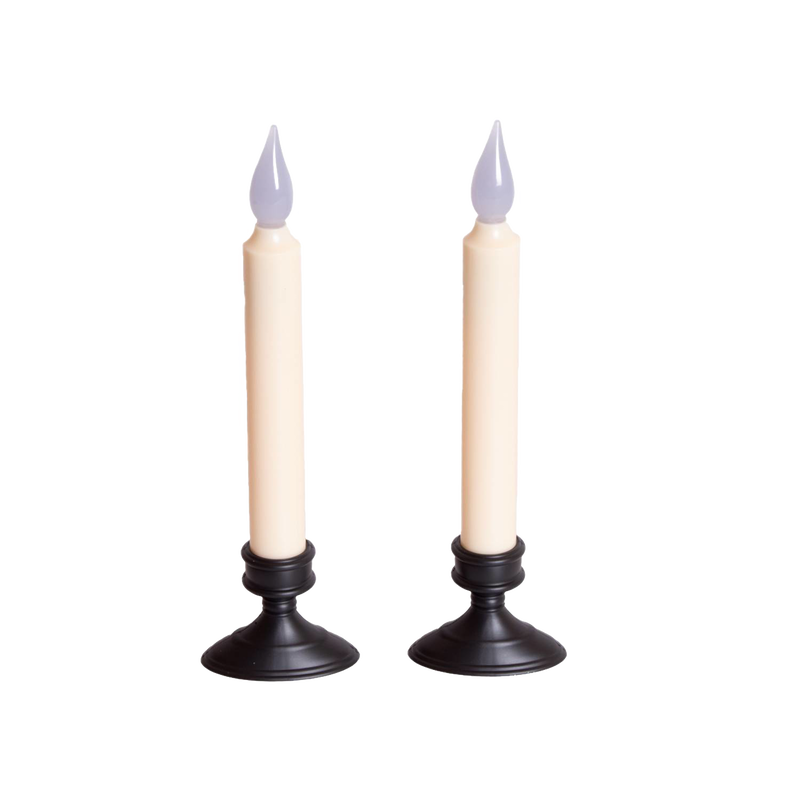Pair of slender cordless LED taper candles with black bases and amber flickering flames, designed for safe window display and holiday decor in lamps and lighting collections.