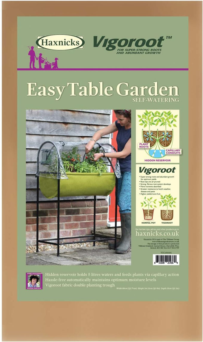 Woman tending to plants in a green raised fabric planter with a clear polyethylene greenhouse cover and black metal frame, designed for easy self-watering in Farm, Garden & Tool and Garden Accessories collections.