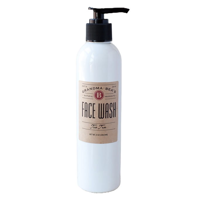 White 8-ounce pump bottle of all-natural tea tree face wash with a simple tan label, handcrafted in the USA, featured in Health & Wellness and Grooming collections.