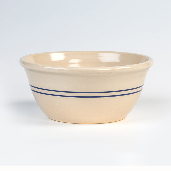 Handcrafted stoneware bowl with two dark blue stripes on a creamy beige background, made in the USA, perfect for Kitchen & Food, Cookware, and Baking Supplies collections.