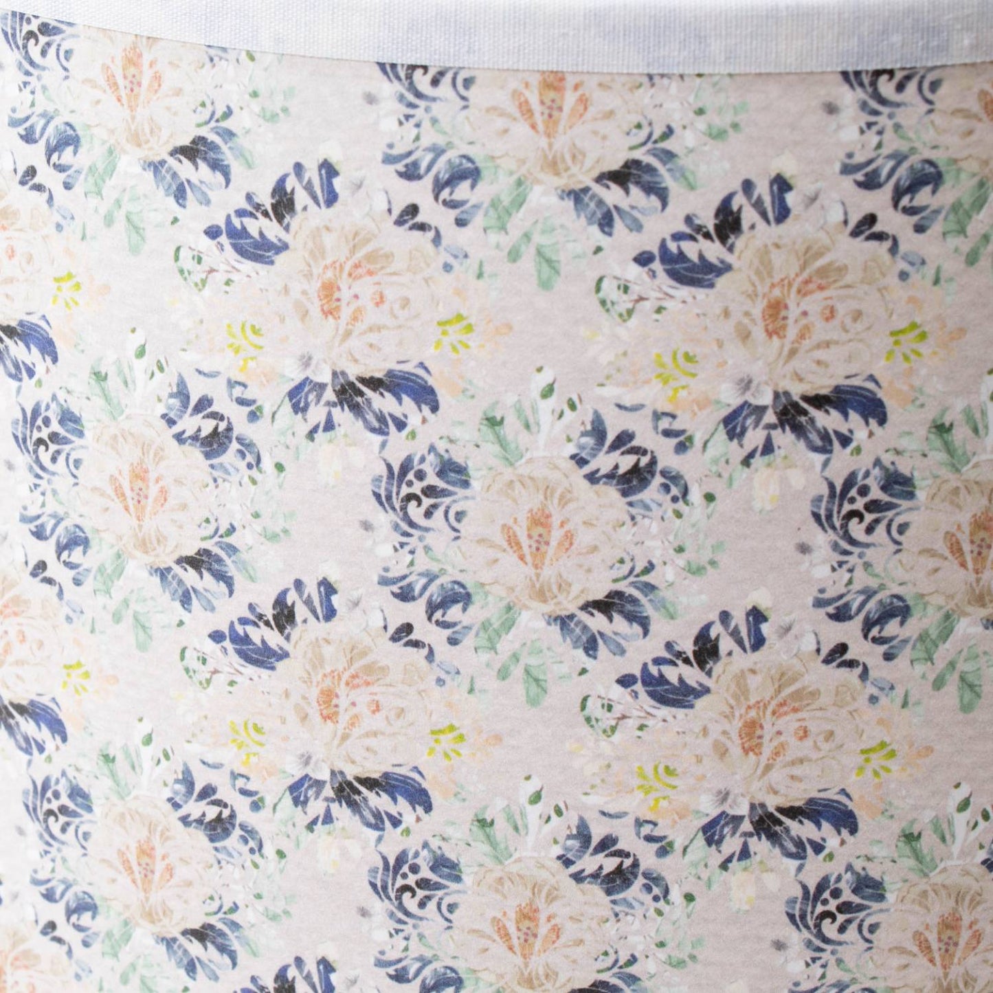 Close-up of a handcrafted floral tapestry parchment lamp shade with soft pastel tones, designed to diffuse light gently, featured in Lamps & Lighting and Lamp Shades collections.