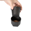 Handheld cast iron spice grinder set with textured grinding surface and bamboo lid, designed to crush coarse pink Himalayan salt crystals, part of Kitchen & Food and Best Sellers collections.