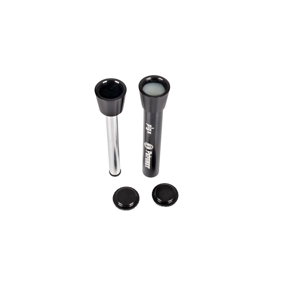 Two compact fire starting plungers with black tops and caps, one filled with tinder, designed for reliable use in camping, emergency supplies, and farm tool collections.