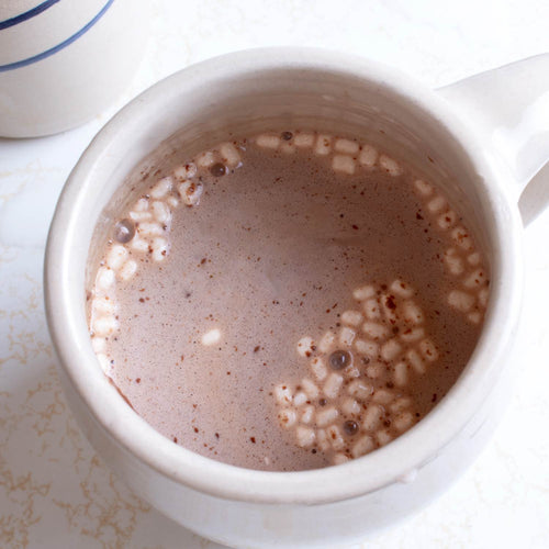 Close-up of creamy hot chocolate with mini marshmallows in a white mug, showcasing a comforting beverage from the Kitchen & Food, Snacks and Sweets, Beverages, USA Made, and Best Sellers collections.