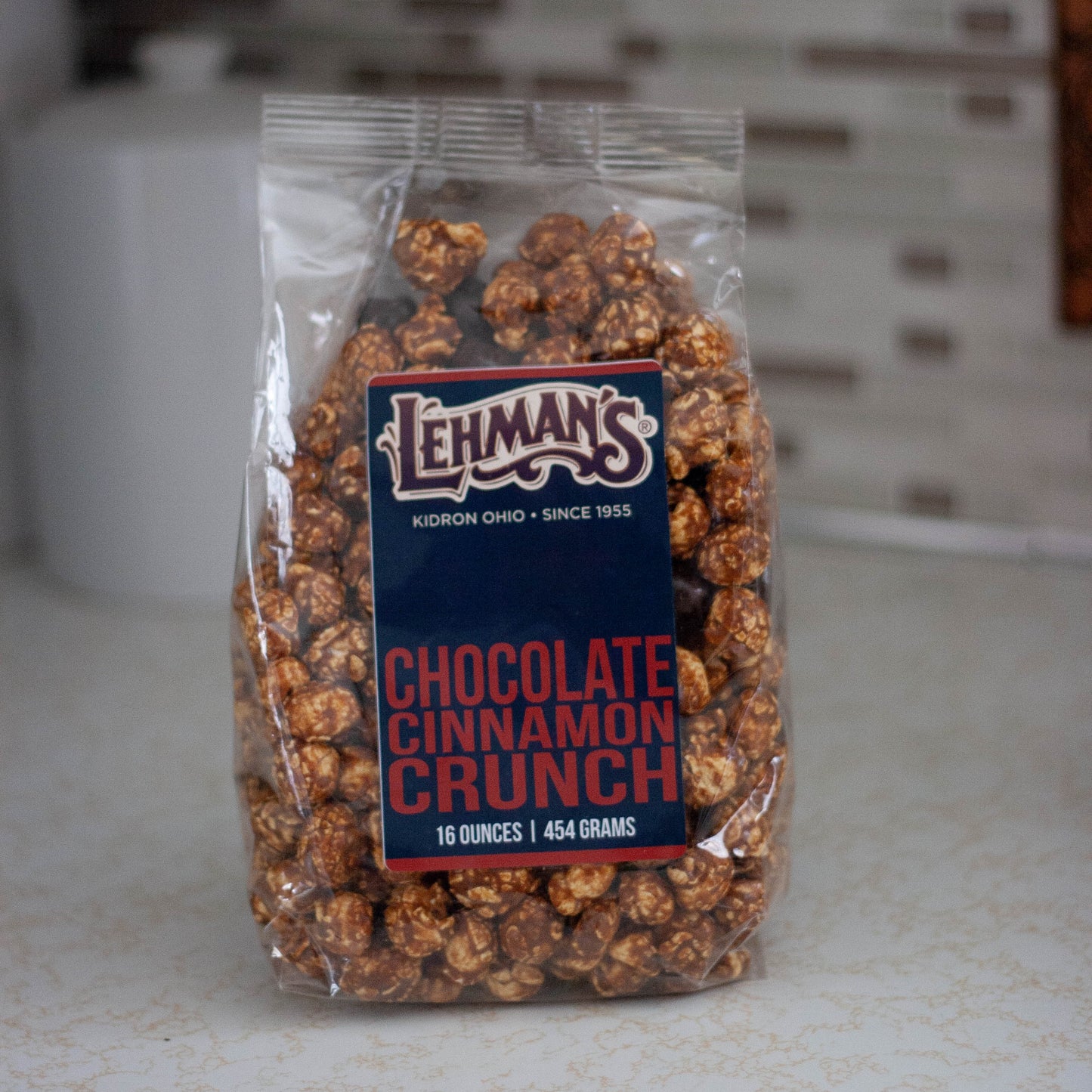 Clear bag of handcrafted chocolate cinnamon crunch popcorn by Lehman's, a unique sweet and spicy snack made in USA, featured in Kitchen & Food, Food, Snacks and Sweets, Popcorn, USA Made, and Best Sellers collections.