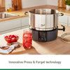 Electric water bath canner with stainless steel pot and black base featuring heat sensors and control dial, shown with fresh tomatoes in jar and kitchen countertop setup for food preservation.