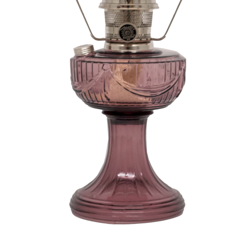 Handcrafted glass oil lamp with a rose-tinted Lincoln Drape pattern font and base, featuring a polished brass burner and clear chimney, perfect for Farm, Garden & Tool, Lamps & Lighting, Oil Lamps, Table Lamps, Best Sellers, Homesteading, and Promo Eligible collections.