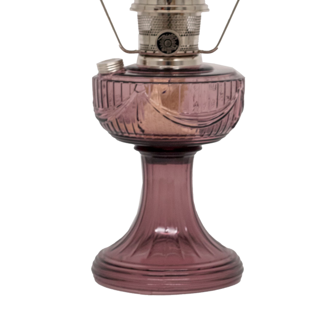 Handcrafted glass oil lamp with a rose-tinted Lincoln Drape pattern font and base, featuring a polished brass burner and clear chimney, perfect for Farm, Garden & Tool, Lamps & Lighting, Oil Lamps, Table Lamps, Best Sellers, Homesteading, and Promo Eligible collections.