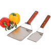 Pair of handcrafted professional kitchen utensils with high-carbon stainless steel blades and wooden handles, accompanied by fresh bell peppers and parsley, ideal for Kitchen & Food, Kitchen Gadgets, Cooking and Baking Helpers, USA Made, Best Sellers, and Promo Eligible collections.