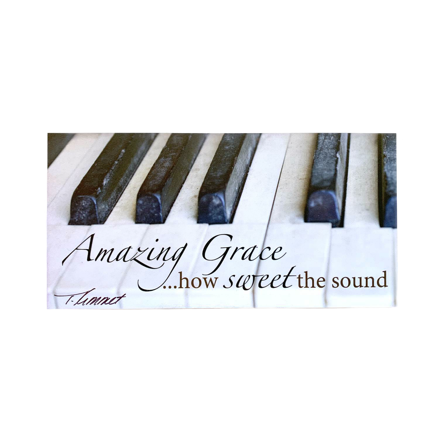 Handcrafted scenic magnet featuring close-up of worn piano keys with the uplifting phrase “Amazing Grace…how sweet the sound,” perfect for Home & Decor, Best Sellers, and Promo Eligible collections.