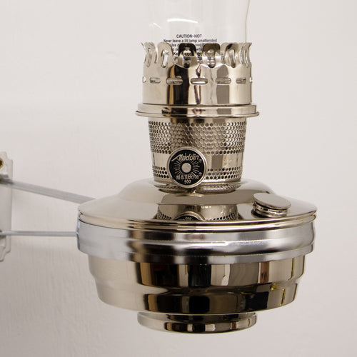 Chrome-plated wall-mounted oil lamp with clear glass chimney and metal burner, providing bright light for farm, garden, emergency, and lighting needs in best sellers and promo collections.