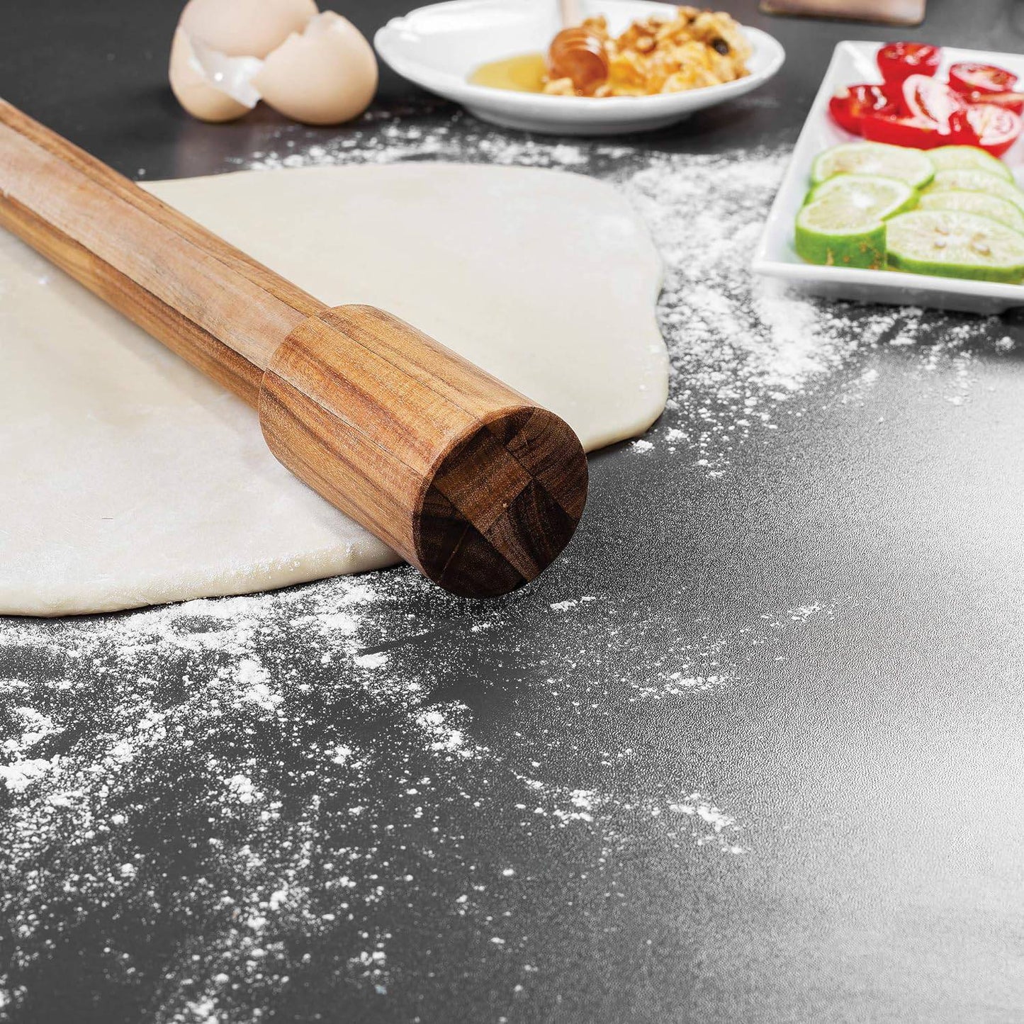 Handcrafted acacia wood rolling pin with fixed handles resting on rolled dough dusted with flour, surrounded by ingredients for baking, ideal for Kitchen & Food, Cookware, Baking Supplies, Best Sellers, and Promo Eligible collections.