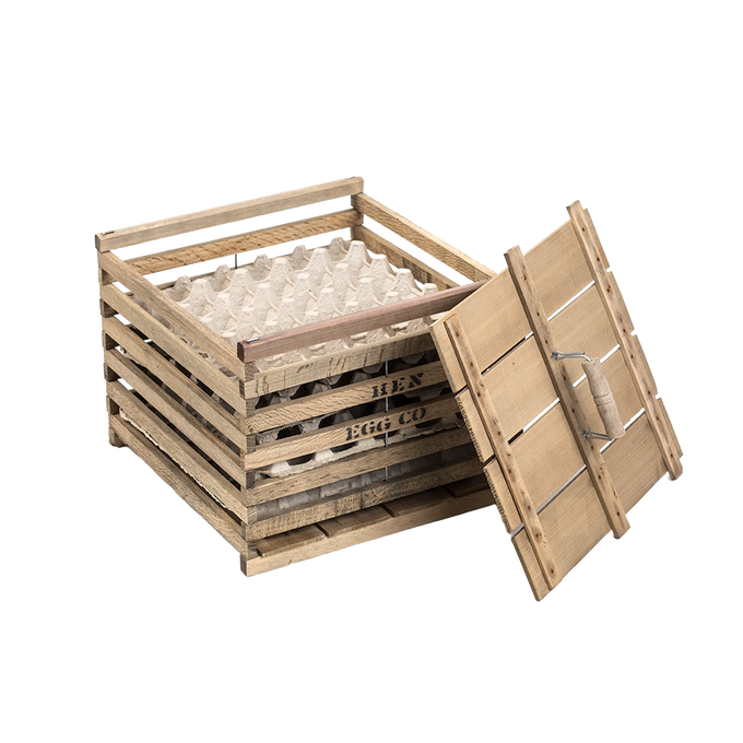 Handcrafted wooden egg crate with a slatted design and removable lid, ideal for safely carrying eggs on the farm or as a rustic barn accessory in animal care and chicken collections.
