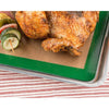 Crispy roasted chicken and vegetable skewer resting on a green-edged non-stick silicone baking mat set on a metal tray, ideal for Kitchen & Food and Baking Supplies collections.