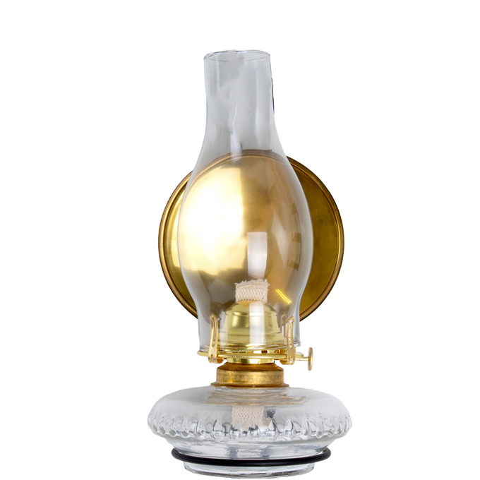 Clear glass oil lamp with a polished solid brass reflector behind the chimney, designed to enhance light projection, crafted in USA and part of lamps, oil lamps, and best sellers collections.