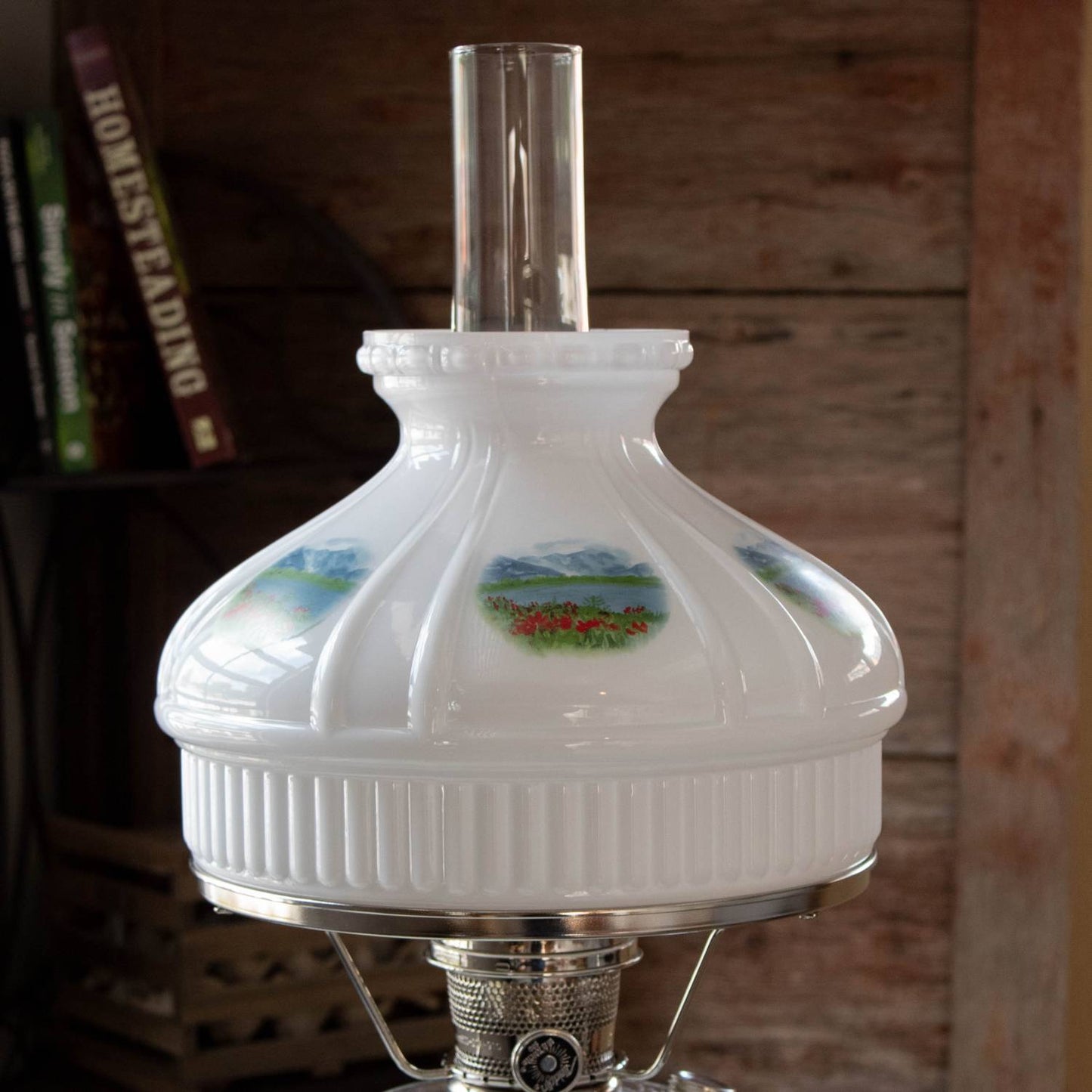 Handcrafted 10-inch glass lamp shade with Alpine Meadow floral and mountain motifs, designed to soften light in lamps and lighting, parts, and accessories collections.