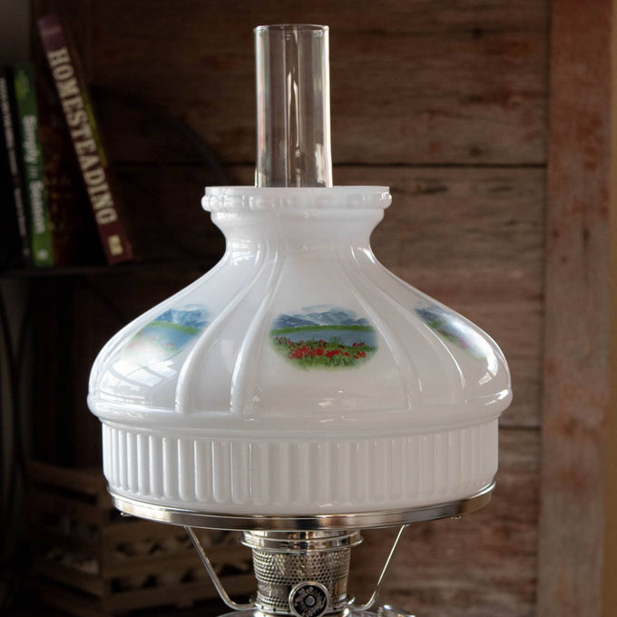 Handcrafted 10-inch glass lamp shade with Alpine Meadow floral and mountain motifs, designed to soften light in lamps and lighting, parts, and accessories collections.