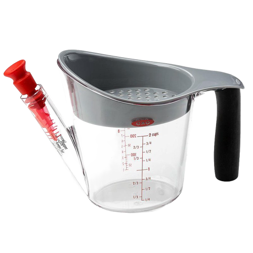 Clear fat separator cup with gray top and soft black grip handle, featuring measurement markings and red stopper for controlled pouring, ideal for Kitchen & Food and Kitchen Gadgets collections.
