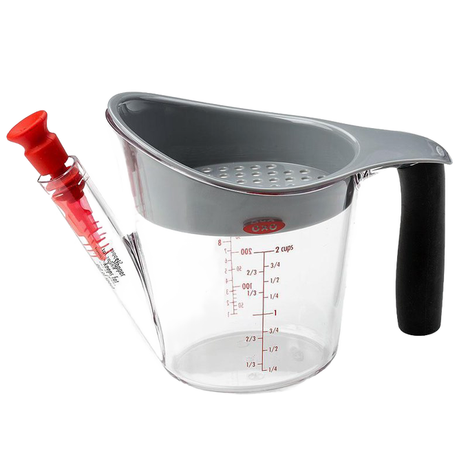 Clear fat separator cup with gray top and soft black grip handle, featuring measurement markings and red stopper for controlled pouring, ideal for Kitchen & Food and Kitchen Gadgets collections.