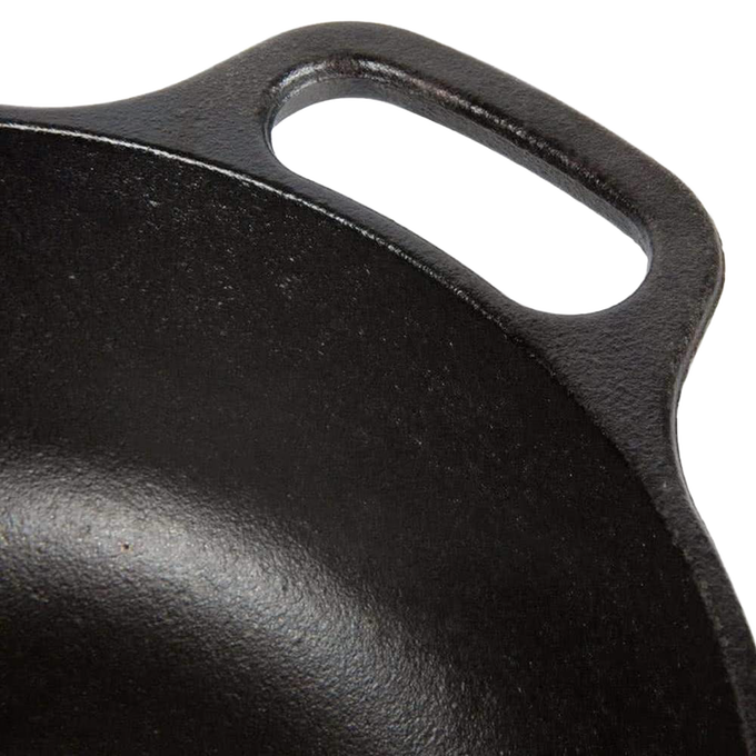 Close-up of the handle on a handcrafted black cast iron cookware piece, designed for durability and heat retention; ideal for Kitchen & Food, Cast Iron, Cookware, USA Made, Best Sellers, and Promo Eligible collections.