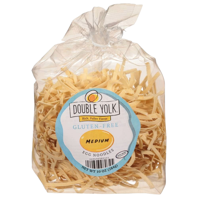 Clear plastic bag containing medium gluten-free egg noodles with a blue and white label featuring Double Yolk branding, showcasing handcrafted pasta from USA, part of Kitchen & Food and Gluten Free collections.
