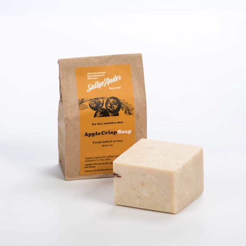 Handcrafted hypoallergenic bar soap with a creamy beige tone and subtle natural speckles, paired with rustic kraft paper packaging, made in USA, ideal for Health & Wellness, Grooming and Soaps collections.