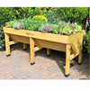 Handcrafted elevated wooden garden bed in natural finish growing a variety of vegetables and herbs, designed for easy planting without bending, featured in Farm, Garden & Tool, Garden Accessories, Seeds and Planting, Best Sellers, and Promo Eligible collections.