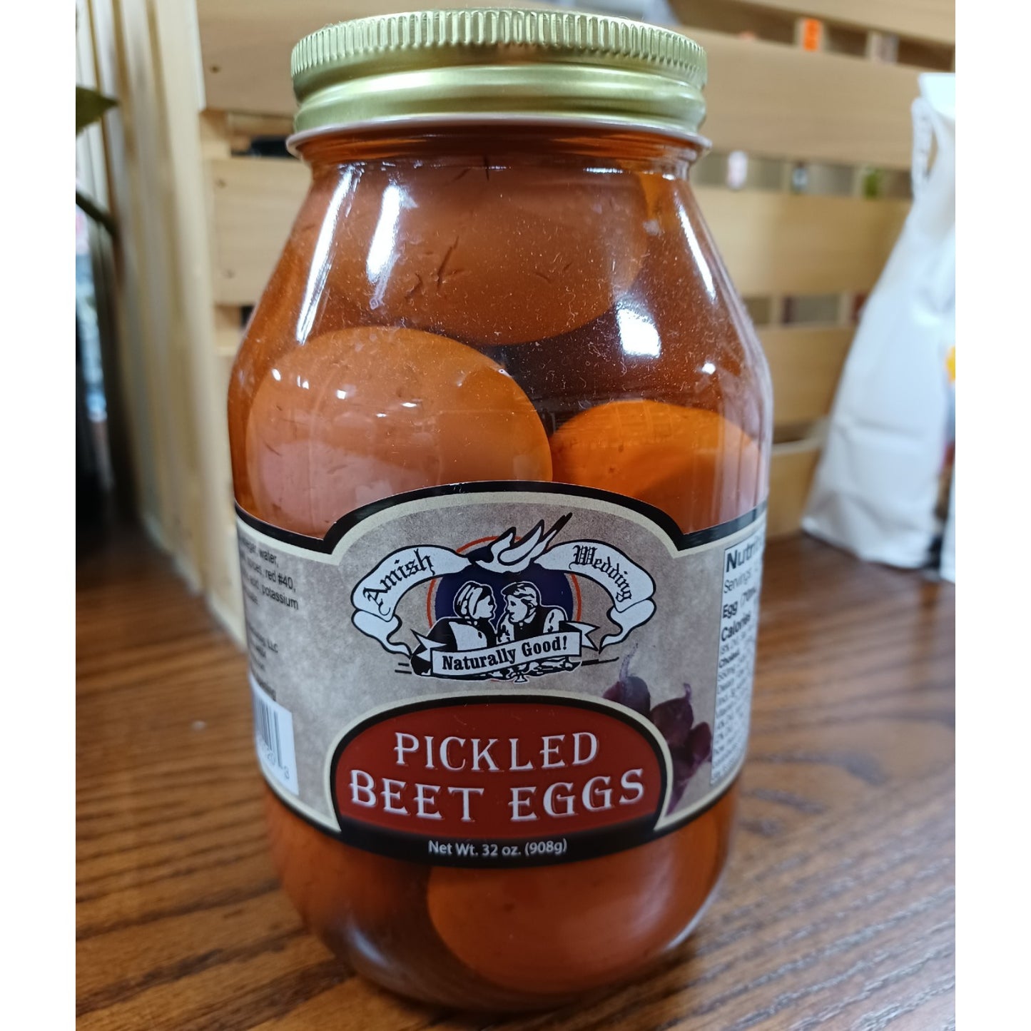Clear glass jar of handcrafted pickled beet eggs in rich red brine with vintage-style label and metal lid, made in USA, ideal for Kitchen & Food, Pantry, USA Made, Best Sellers, and Promo Eligible collections.