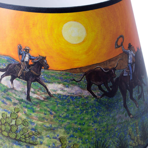 Handcrafted Southwestern-style parchment oil lamp shade with warm sunset tones and artwork of cowboys riding horses and herding cattle, designed for Aladdin lamps in Lamps & Lighting and Lamp Shades collections.