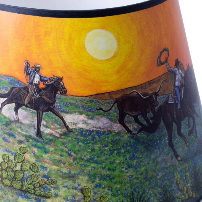 Handcrafted Southwestern-style parchment oil lamp shade with warm sunset tones and artwork of cowboys riding horses and herding cattle, designed for Aladdin lamps in Lamps & Lighting and Lamp Shades collections.
