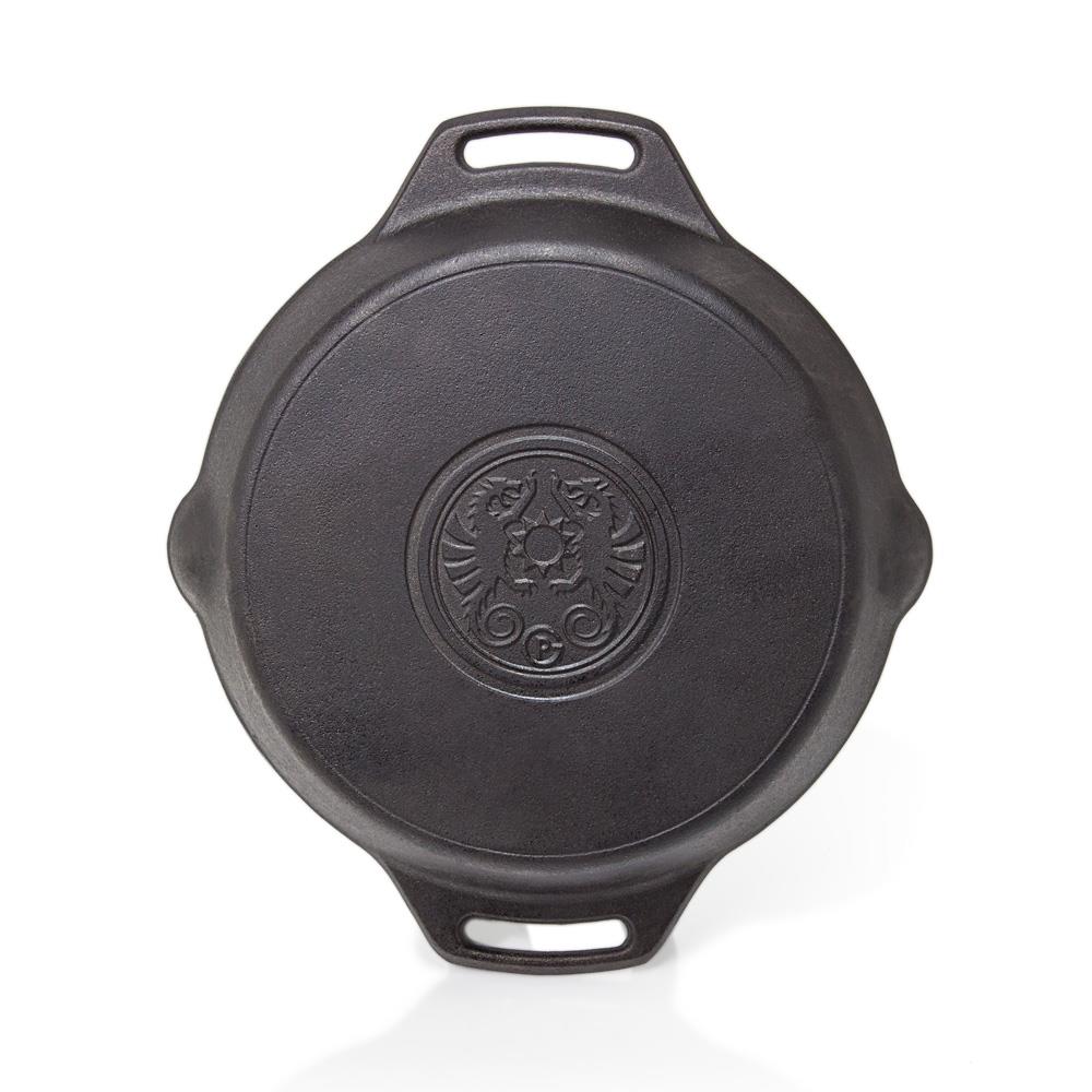 Top view of a durable cast iron skillet with two elongated handles and embossed emblem, handcrafted for versatile use in farm, garden, kitchen, camping, cookware, and cast iron collections.