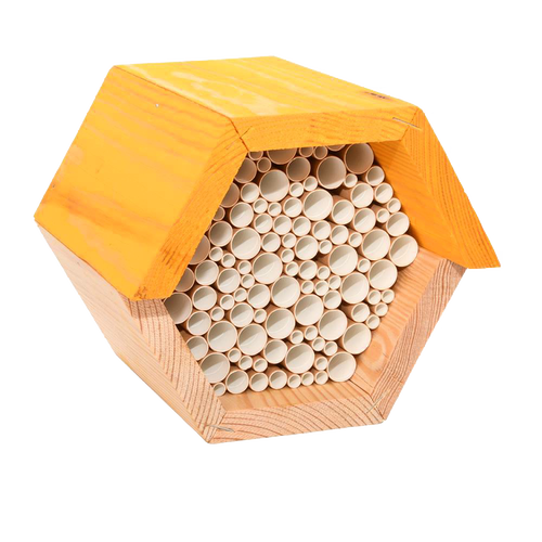Hexagonal wooden bee house with natural pine wood frame and bundled paper straw tubes, designed to provide shelter for beneficial bees, ideal for farm, garden, and outdoor use.