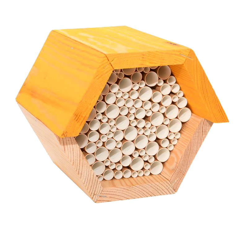 Hexagonal wooden bee house with natural pine wood frame and bundled paper straw tubes, designed to provide shelter for beneficial bees, ideal for farm, garden, and outdoor use.