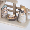 Handcrafted small nativity set with wood stable and attached resin figures of Mary, Joseph, and baby Jesus, designed for easy display in Home & Decor, Holiday Decor, and Best Sellers collections.