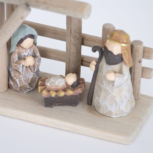 Handcrafted small nativity set with wood stable and attached resin figures of Mary, Joseph, and baby Jesus, designed for easy display in Home & Decor, Holiday Decor, and Best Sellers collections.