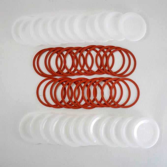 Handcrafted reusable white plastic canning jar lids and red sealing rings designed for regular mouth jars, made in USA, ideal for Kitchen & Food, Food Preservation, and Canning collections.