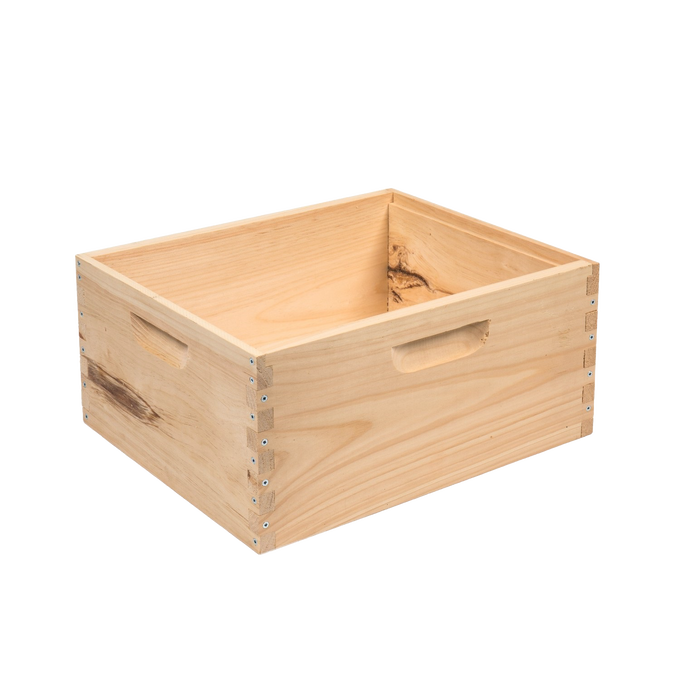 Handcrafted wooden bee box with smooth natural finish, assembled with dovetail joints and built-in handles, made in USA, ideal for beekeeping and farm supplies.