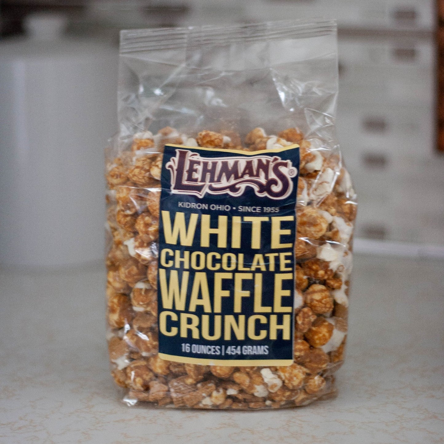 Clear bag of handcrafted white chocolate waffle crunch popcorn, a unique sweet and crunchy treat made in USA, featured in Kitchen & Food, Snacks and Sweets, Popcorn, USA Made, and Best Sellers collections.