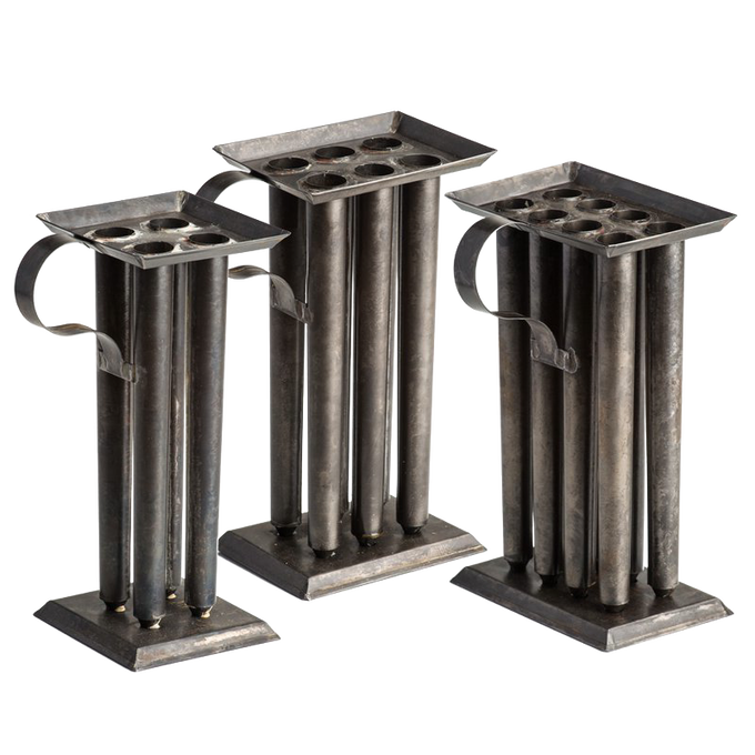 Set of three handcrafted tin molds with multiple cylindrical cavities and sturdy handles, designed for creating tapered candles, ideal for Candlemaking Supplies and Lamps & Lighting collections.