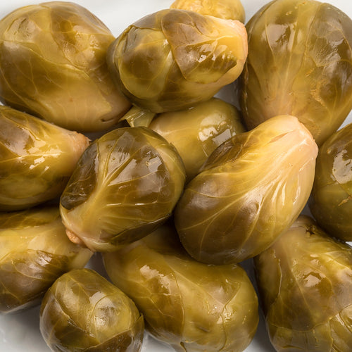 Close-up of glossy, handcrafted pickled Brussels sprouts with a tangy flavor, made in USA, ideal for Kitchen & Food, Food, Pantry, USA Made, Best Sellers, and Promo Eligible collections.