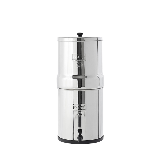 Stainless steel water filtration system with two chambers, featuring black ceramic filter elements, compact design ideal for homesteading and water treatment collections.