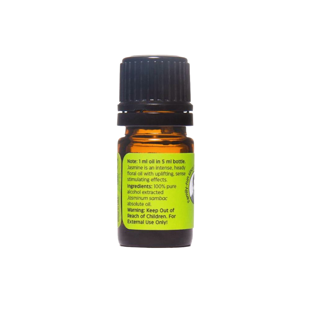 Small amber glass bottle with black cap containing Jasmine Absolute Oil, featuring a green label with usage notes and safety warnings, handcrafted and made in USA.