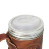 Clear wide-mouth drinking lid securely placed on a glass jar with a brown leather sleeve, part of Kitchen & Food, Dinnerware, Kitchen Gadgets, Kitchen Accessories, USA Made, Best Sellers, and Promo Eligible collections.