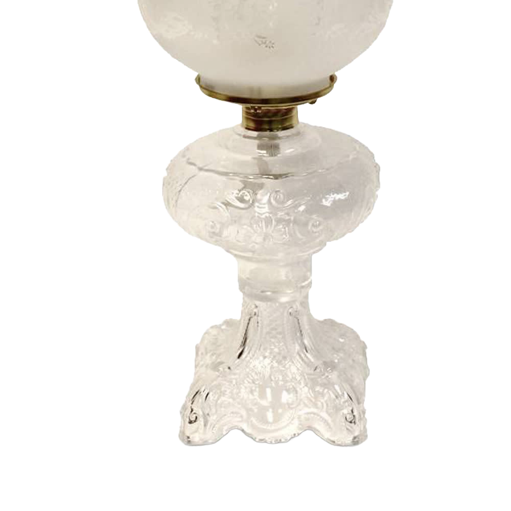 Handcrafted clear glass oil lamp featuring an intricately sculptured base with a heavy brass-plated burner and etched white glass chimney, ideal for Lamps & Lighting, Oil Lamps, Table Lamps, Best Sellers, and Promo Eligible collections.