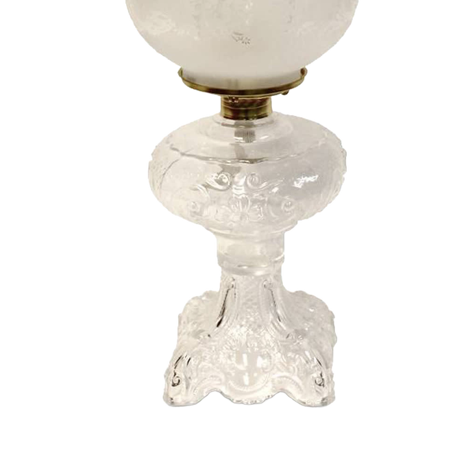 Handcrafted clear glass oil lamp featuring an intricately sculptured base with a heavy brass-plated burner and etched white glass chimney, ideal for Lamps & Lighting, Oil Lamps, Table Lamps, Best Sellers, and Promo Eligible collections.